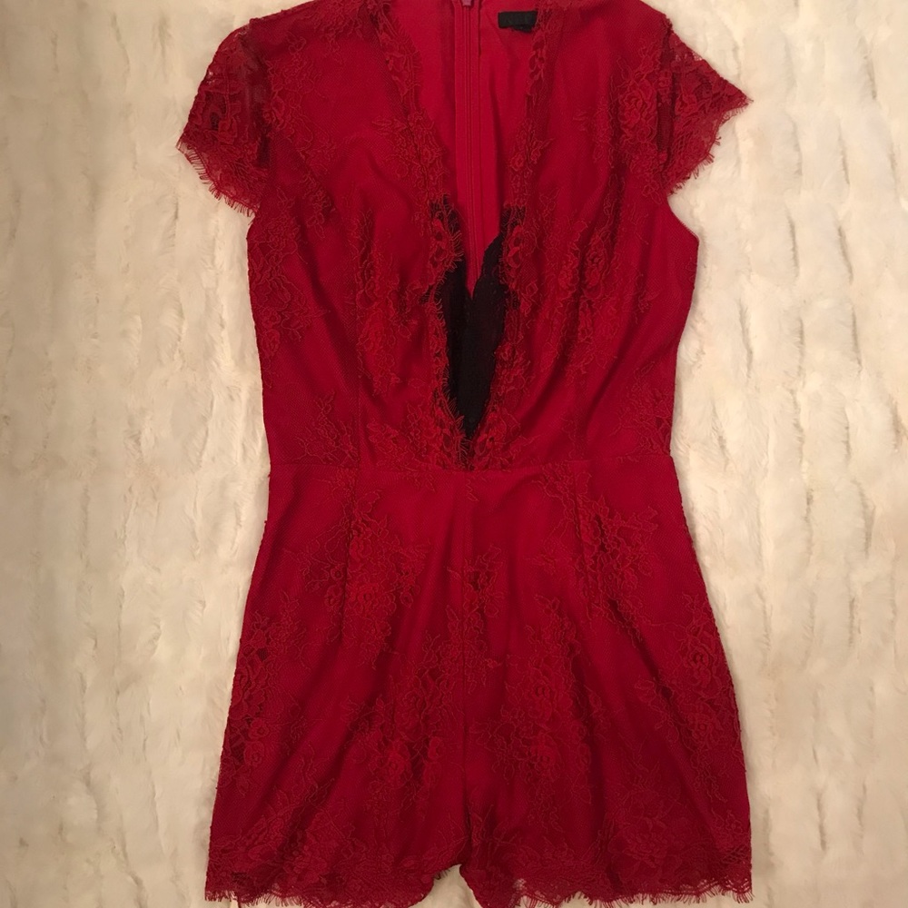 Bebe red lace romper. $219 new. Worn once. Sexy!